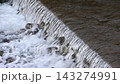 The scenery of foaming water flowing down a mountain stream 143274991