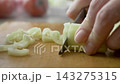 Bell pepper sliced into pieces by hostess 143275315