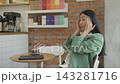Tired Woman Massaging Temples Suffering Headache While Sitting In Modern Cafe 143281716