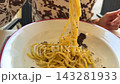 Closeup Of Woman Savoring Pasta. Energetic Woman Devours Truffle Pasta At Market Outdoor Setting 143281933