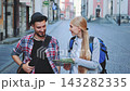 Young tourist couple walking and exploring old European city street 143282335