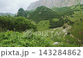Long POV View Driving Past Scenic Mountain Slopes And Green Hills 143284862