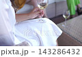 Spontaneous wedding moment capturing bride with stylish braids and gown 143286432