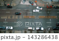 Atmospheric Aerial View Capturing Rainy City Traffic With Reflective Surfaces And Blurred Motion 143286438