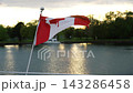 Province Banner Rippling At Sunset. Canadian National Emblem Dancing In Evening Light On Calm Lake Surface 143286458
