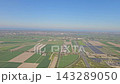 Aerial view of farmland and solar panel arrays after takeoff in the Netherlands 143289050