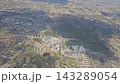 Krakow neighborhoods and a broad green area viewed from an airplane 143289054