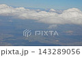 White cumulus clouds above towns and forests during a flight toward Krakow 143289056