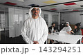 Portrait of smiling Arabic man stands in conference room 143294251