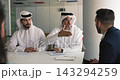 Arabic and European business parties shaking hands 143294259