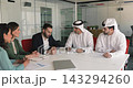 Multicultural business parties signing contract, shaking hands, concluding agreement 143294260