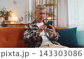 Surprised excited man winner holding smartphone reading good news amazed by online game casino win 143303086