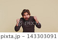Excited amazed winner Hindu man surprise looking at camera with big eyes on beige studio background 143303091