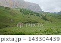 POV Action Driving View Of Massive Rocky Mountain Cliffs And Green Valley 143304439