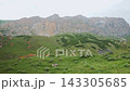 POV Action Motion Shot Passing Massive Rocky Mountains And Green Slopes 143305685