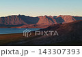 Aerial flyover tracking past rugged peaks at Gilmimyul Bay Provideniya Chukotka 143307393