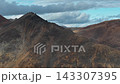 Aerial view cinematic pan right over Rumilet Bay mountain valley, Chukotka 143307395