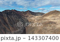 Smooth pan right past rugged peaks over Rumilet Bay coast in remote Chukotka 143307400