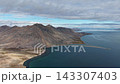 Cinematic pan right over wide Rumilet Bay shoreline and sea, Chukotka 143307403