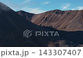 Drone shot panning dramatic shadowed ridge above Abolesheva Bay Chukotka 143307407