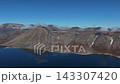 Aerial view orbit over dramatic conical scree peak Abolesheva Bay Chukotka 143307420