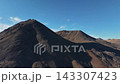 Aerial flyover orbiting majestic rugged summit Abolesheva Bay Chukotka 143307423