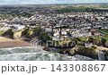 Aerial view of coastal city town near ocean and green landscape Aerial view of coastal city town near ocean and green landscape 143308867