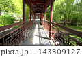 Forward Walk Through Traditional Garden Corridor With Red Railings 143309127