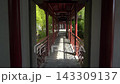 Walk Through Traditional Covered Garden Corridor With Red Wooden Columns  143309137