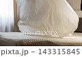 The steward trow up the sheet over the bed and smoothly and precisely straightens it on the mattress.. Slow motion. Close up shot 143315845