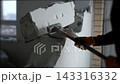 Slow motion demolition showing debris and dust flying. 143316332