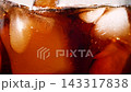 Slow motion closeup pouring cola with ice cubes and bubbles, soft drink texture 143317838