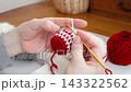 Handmade Tomte, a Nordic fairy, out of yarn - the hands of a crocheter 143322562