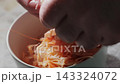 Peeling Boiled Shrimp Shell by Hand Culinary Preparation Close-Up 143324072