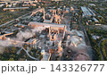 Cement plant with rotary kilns, drum dryers and stack plume in a drone aerial view. Clinker production, construction materials and industrial emissions monitoring 143326777