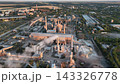Cement plant with rotary kilns, drum dryers and stack plume in drone aerial view. Clinker production, construction materials, heavy industry and emissions monitoring 143326778