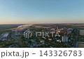 Cement plant and steelworks drone aerial view across a shared industrial district. Heavy industry, construction materials and regional supply chains 143326783