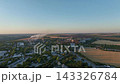 Cement plant and steelworks drone aerial over access roads and surrounding farmland. Industrial infrastructure, regional development and land use planning 143326784