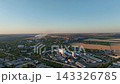 Industrial district with cement plant, steelworks and warehouses in a drone aerial view. Commodity logistics, bulk storage and regional manufacturing supply chains 143326785