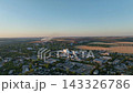Industrial district with cement plant, steelworks and warehouses in a drone aerial view. Commodity logistics, bulk storage and regional manufacturing supply chains 143326786