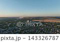 Residential neighborhoods beside cement and steel plants in a drone aerial view. Urban planning, regional development and industrial residential land use 143326787