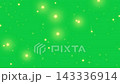 Christmas: Sparkling yellow stars falling diagonally across a green screen in a loop (4K) 143336914
