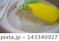Spraying a toilet bowl with a cleaning solution. Clean toilet 143340927