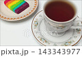 Rainbow Layer Cake Slice and Hot Black Coffee Zooming Close Up 143343977