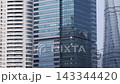 Glass Office Tower Between Residential High-Rises in Shanghai Urban City Center With Reflective Facade 143344420
