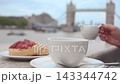 Hand Pouring Milk into Tea Mug  143344742
