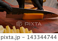 cheddar cheese on wooden board with ingredients 143344744