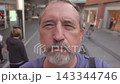 Man Going Up on Escalator in Shopping Mall 143344746