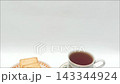 Black coffee cup with crispy crackers on white background view 143344924