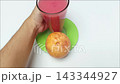 Hand removing guava juice glass overhead white background view 143344927
